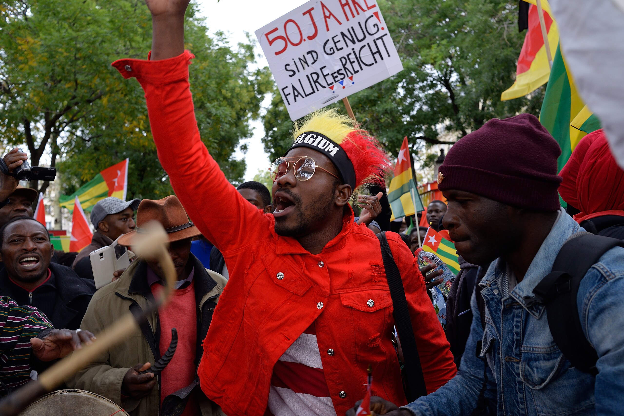 Pascal.Van https://commons.wikimedia.org/wiki/File:Protest_against_Faure_Gnassingbe_in_Belgium.jpg; https://flickr.com/photos/67580126@N05/37354426990